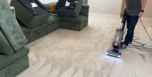 Carpet cleaning under furniture with protective tabs — step 8 of our process